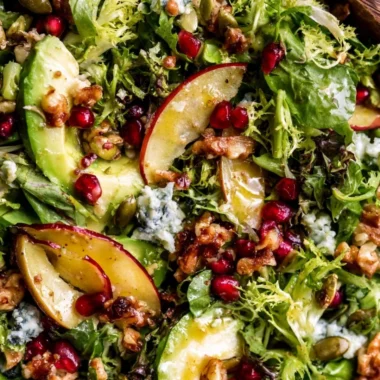 Festive Christmas Salad topped with honey mustard dressing and fresh ingredients