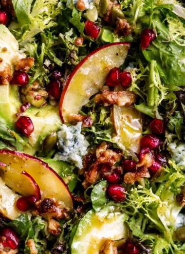 Festive Christmas Salad topped with honey mustard dressing and fresh ingredients