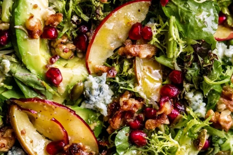 Festive Christmas Salad topped with honey mustard dressing and fresh ingredients