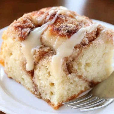 Deliciously layered Cinnamon Roll Coffee Cake ready to be served