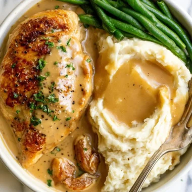 Creamy Garlic Chicken dish served with fresh herbs and vegetables