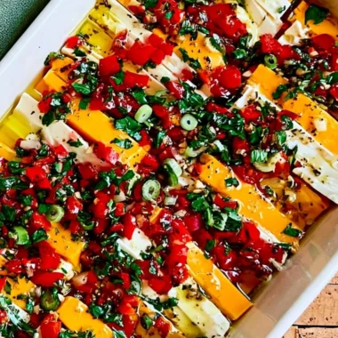 Delicious marinated cheese recipe with fresh herbs and spices.